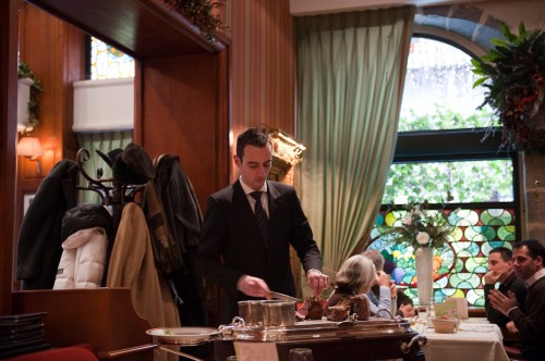 Our waiter in a very well tailored suit (slim fit!) You can see the guests are all well dressed in the background.